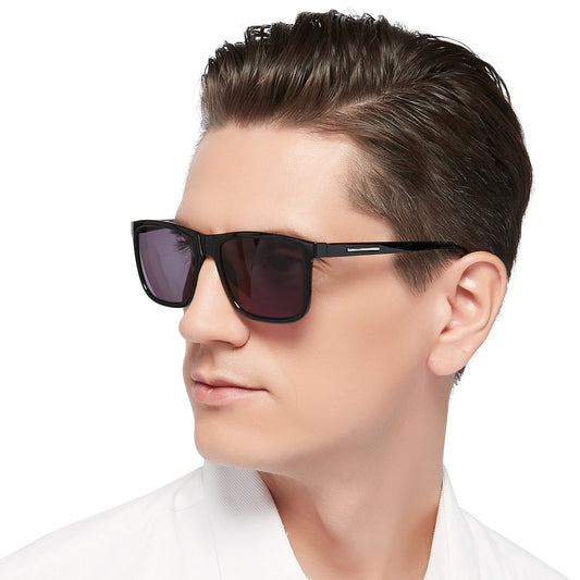 Man wearing dark sunglasses with a white background