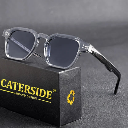 Clear-framed glasses on a black box with 'Caterside' branding.