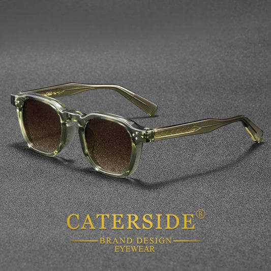 Sunglasses with gold frame and dark lenses on a gray background, featuring the Caterside brand.