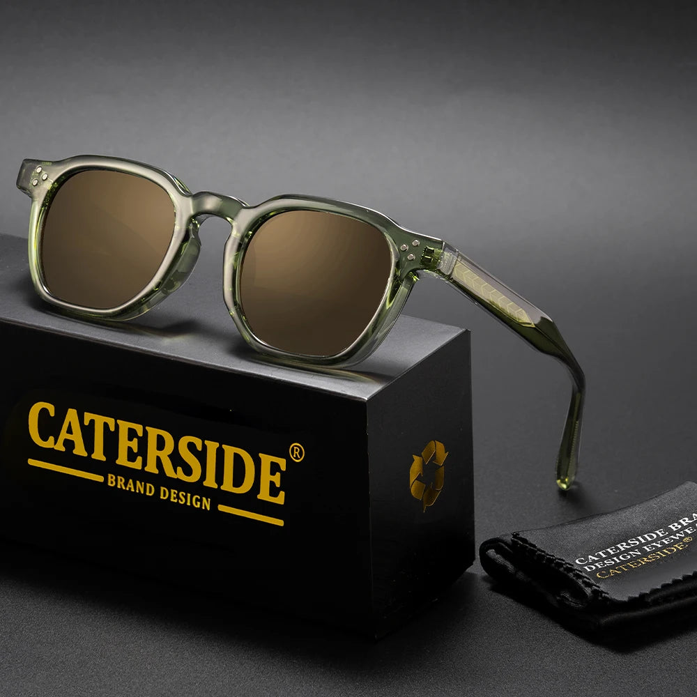 Sunglasses with green frame and brown lenses on a black box labeled 'Caterside'.