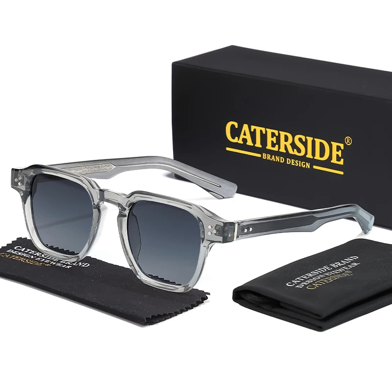 Clear sunglasses with dark lenses on a white background, featuring Caterside branding.