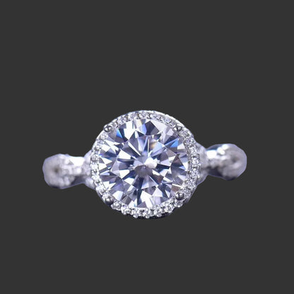 A 925 sterling silver ring with a central moissanite stone surrounded by smaller accent stones, 